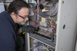 technician-examining-furnace